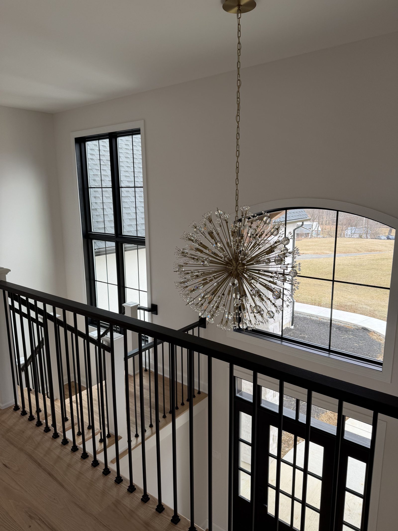 Stair landing with chandelier
